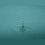 Water drop forming a spike