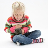 Girl with grey kitten