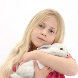 Girl with young white rabbit