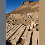 Adobe mud bricks drying and stacked ready for use