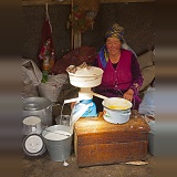 Kyrgyz woman making cream